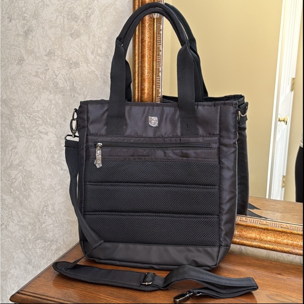 NWOT GAIAM black tote or crossbody yoga bag. Roomy with pockets and storage.